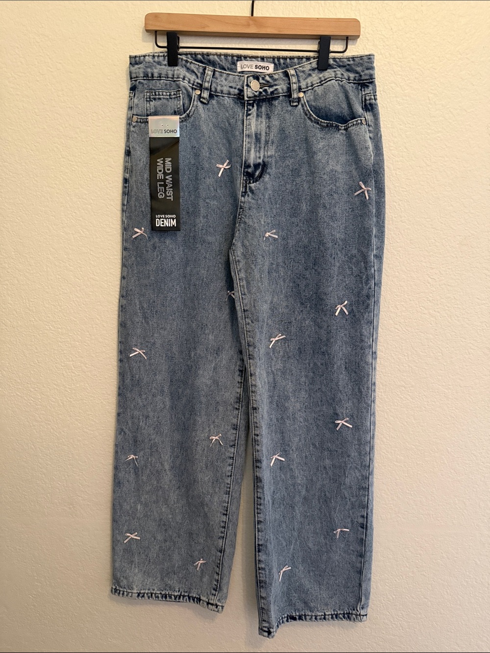 Love Soho Blue Acid Wash Mid Waist Wide leg Jeans with Pink Bow detail
